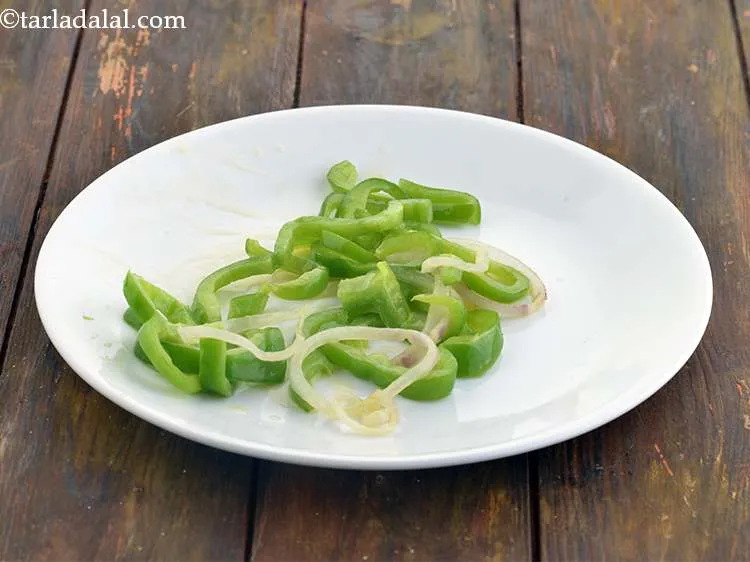 Step 15 – Once a little translucent, remove half of the onion and capsicum rings in a plate …