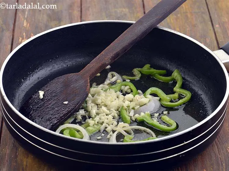 Step 16 – Now add the chopped garlic to the pan. You can use garlic paste as well.