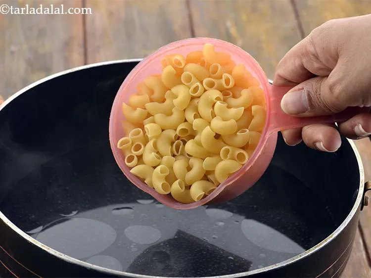 Step 5 – Once it starts boiling, add the macaroni. We have used 3/4 cup raw macaroni for …