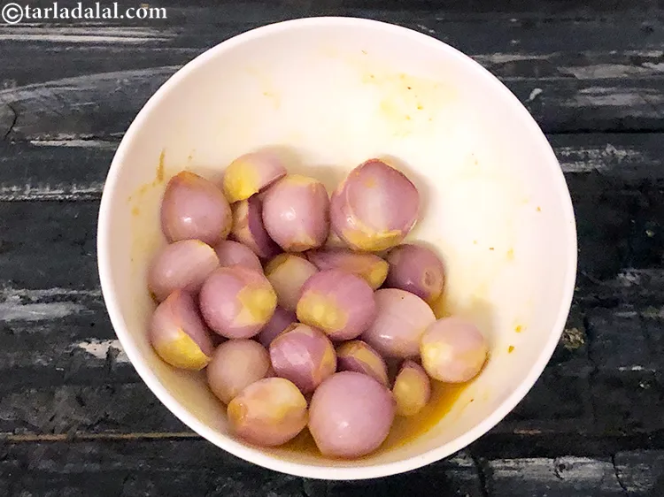 Step 9 – Drain out the excess liquid extracted by the marinated onions.