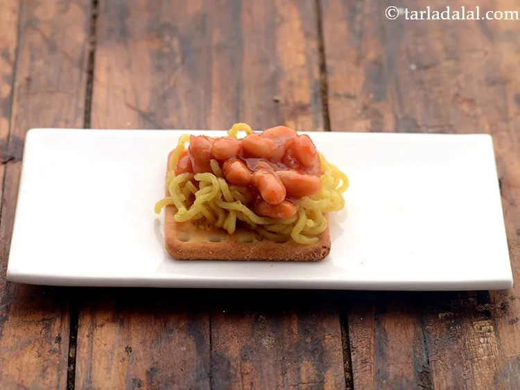 Step 15 – Add 1 tsp of the baked beans topping.