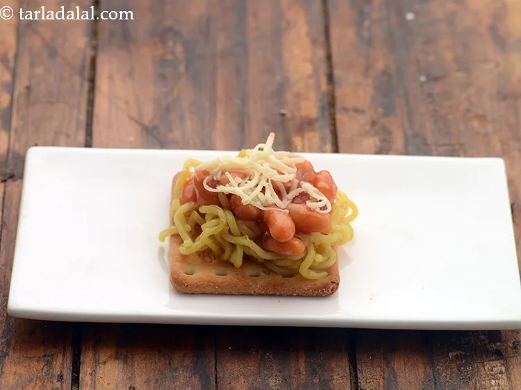 Step 16 – Finally sprinkle &frac12; tsp of cheese evenly over it. we have used processed cheese, mozzarella …