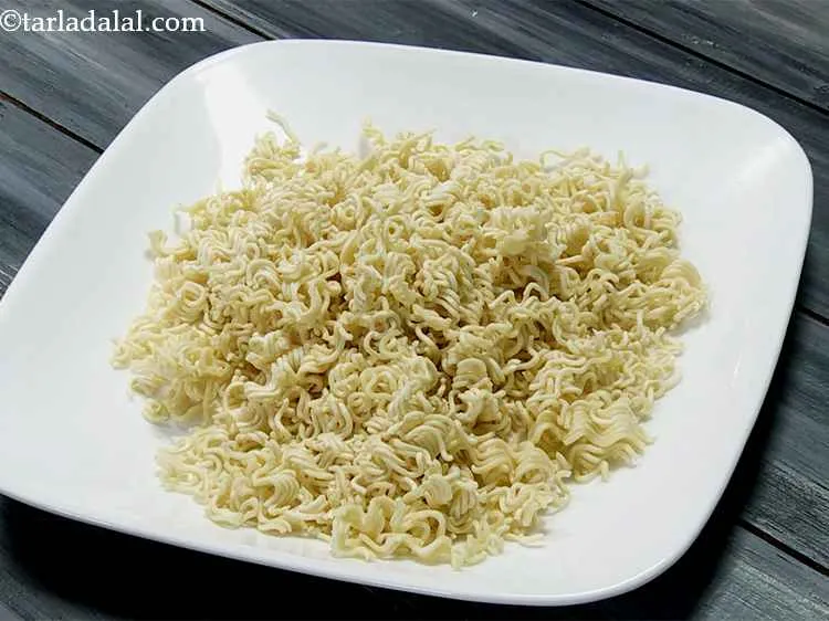 Step 3 – Lightly crush the maggi noodles into small pieces. To make this task simpler, put maggi …