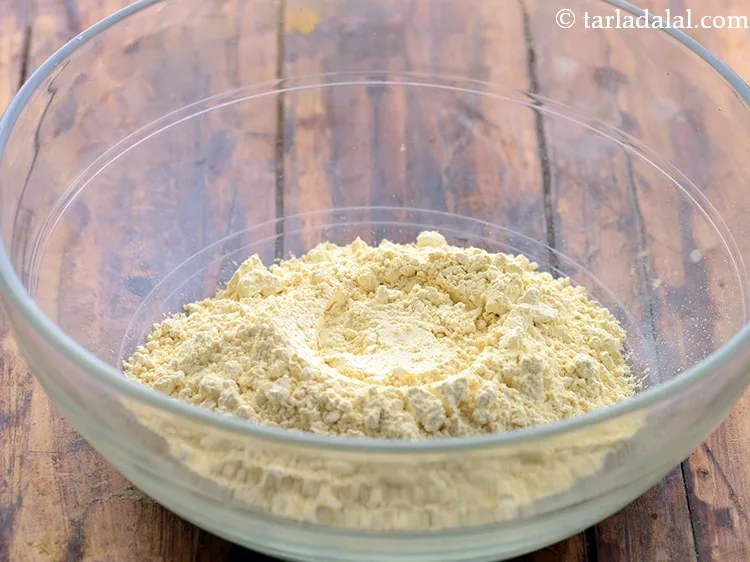 Step 6 – Further to make batter for maggi veg omelette, in a deep bowl take besan.