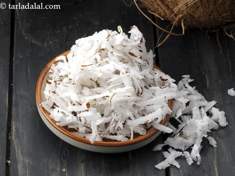 Step 2 – <strong>For the paste of Maharashtrian patal bhaji</strong>, grate the coconut first.