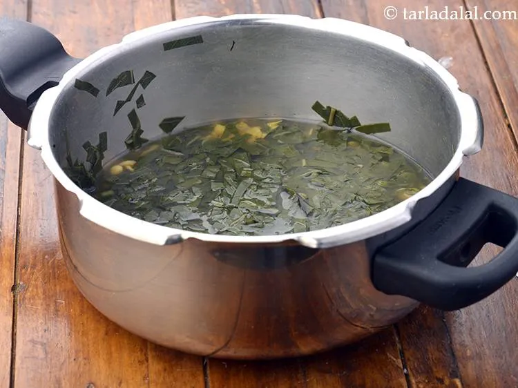 Step 11 – Mix well and pressure cook for 3 whistles. Allow the steam to escape before opening …