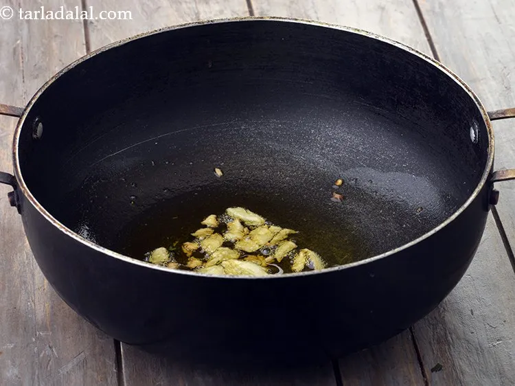 Step 7 – Once the oil is hot, add crushed garlic, saute for 30 seconds. Garlic would give …