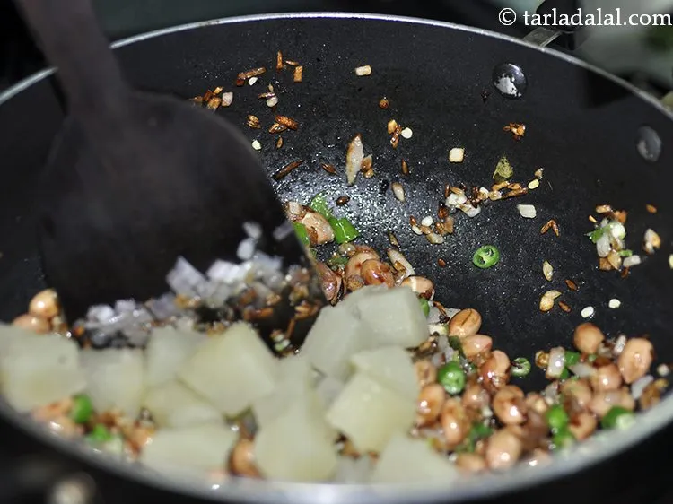 Step 34 – Add the potato. We have used boiled potato as it cookes faster and taste better.