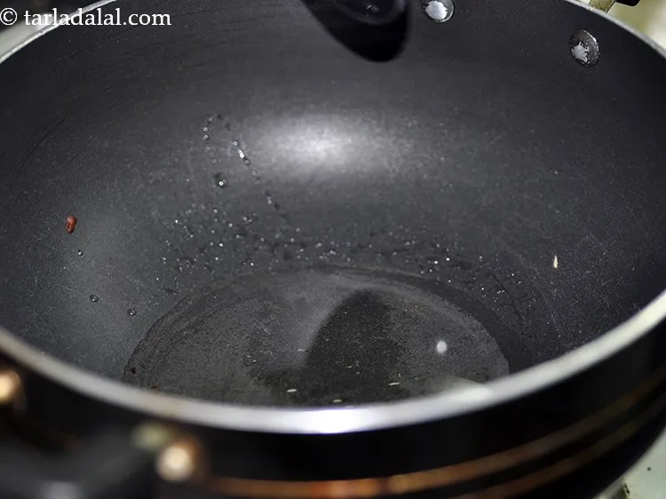 Step 24 – In a nonstick deep pan, heat the oil in a deep non-stick pan and add …