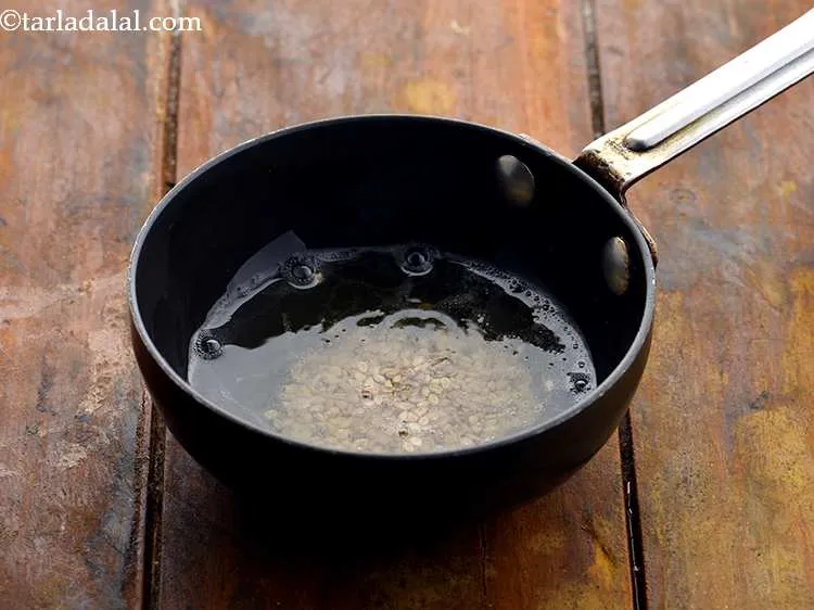 Step 23 – When the mustard seeds crackle, add&nbsp;1 tsp&nbsp;<a href="https://www.tarladalal.com/glossary-sesame-seeds-til-gingelly-seeds-612i">sesame seeds (til)</a>.