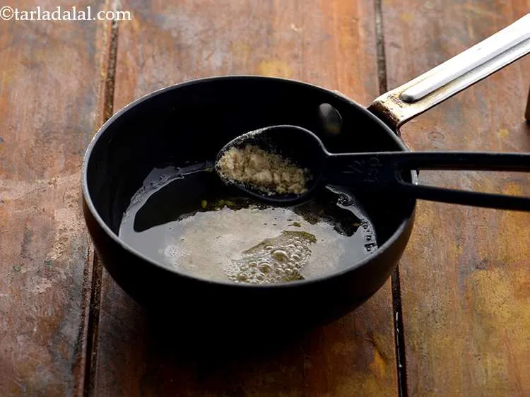 Step 24 – Add a pinch of&nbsp;<a href="https://www.tarladalal.com/glossary-asafoetida-hing-113i">asafoetida (hing)</a>.