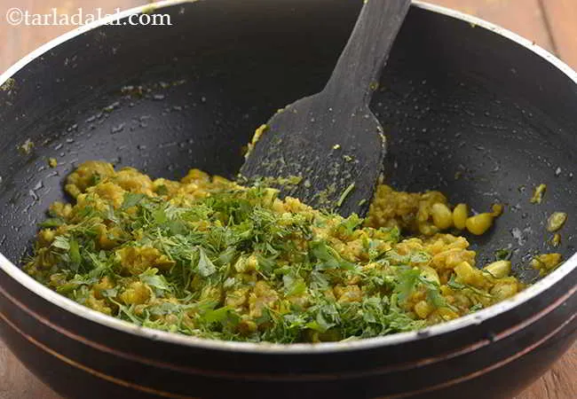 Step 15 – Add the coriander and mix well.