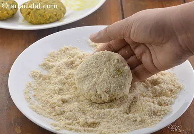 Step 23 – Remove it and roll in the bread crumbs till it is evenly coated from all …