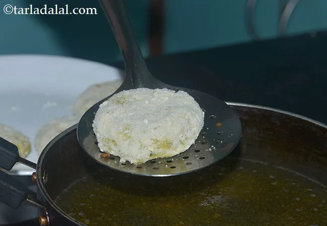Step 24 – Heat the oil in a deep pan or kadhai and slowly place the kebabs in …