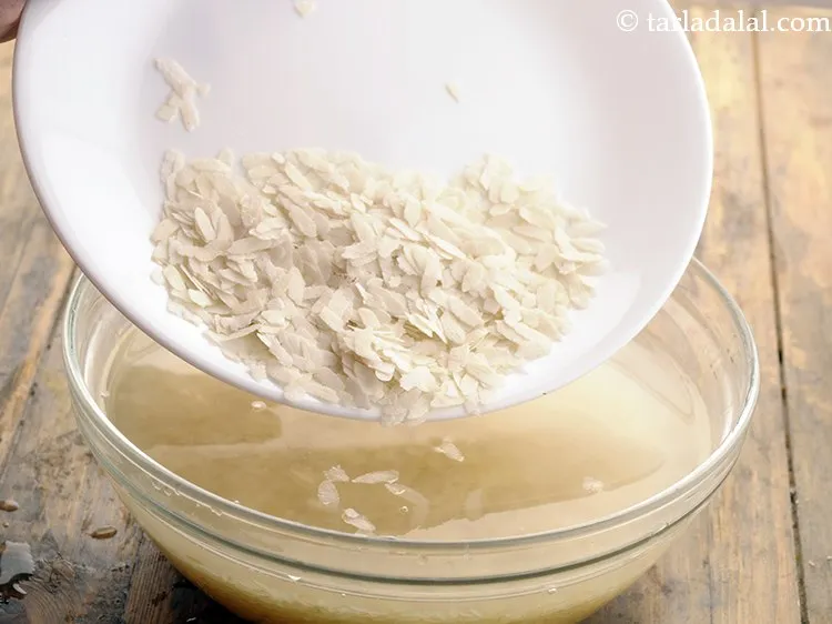 Step 16 – Add 1 1/2 tbsp&nbsp;<a href="https://www.tarladalal.com/glossary-thick-beaten-rice---jada-poha-2455i">thick beaten rice (jada poha)</a>.