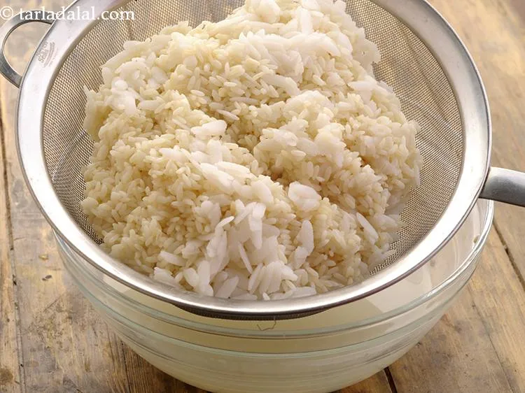 Step 18 – After 4 hours, drain the soaked parboiled rice and beaten rice. It will look like …