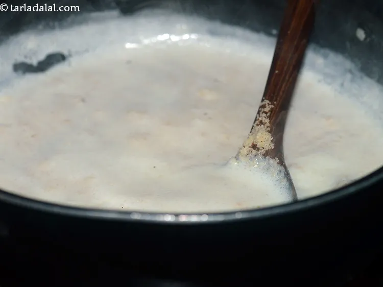 Step 10 – Mix well and cook for 23-25 minutes or till the milk has reduced to hlf, …