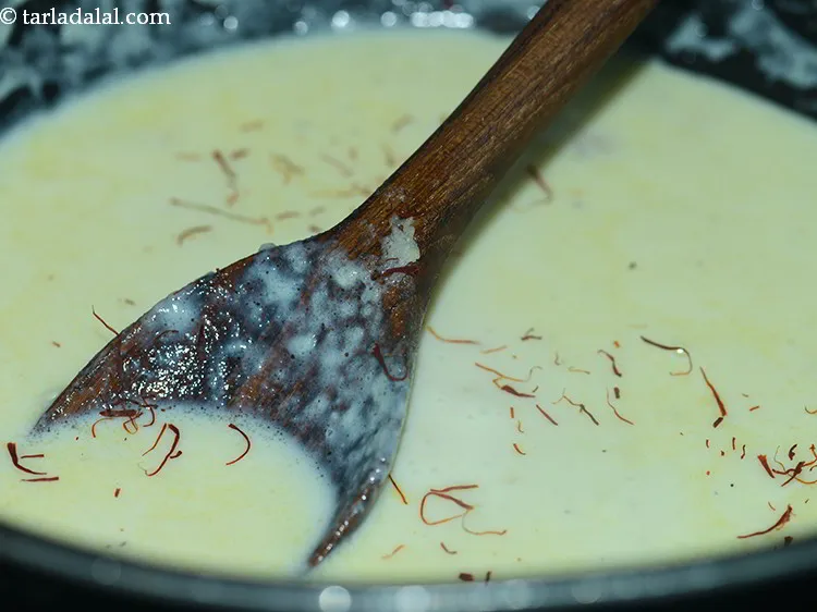 Step 11 – Add the saffron strands. It provides a beautiful yellow hue to <strong>makhana kheer</strong> and a …