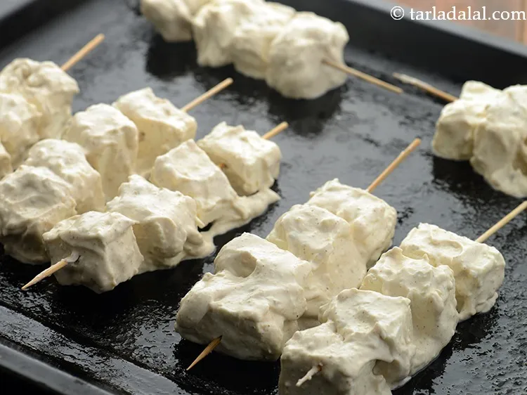 Step 14 – Arrange the paneer pieces on the wire rack in a pre-heated oven at 200&deg;C (400&deg;F). …
