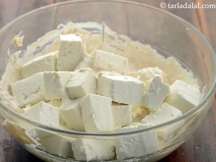 Step 11 – To prepare makhmali paneer tikka, add the paneer cubes in the prepared marinade. You can …