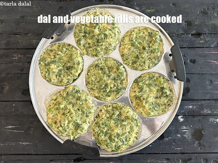Step 38 – Dal and vegetable&nbsp;idlis are cooked.&nbsp;