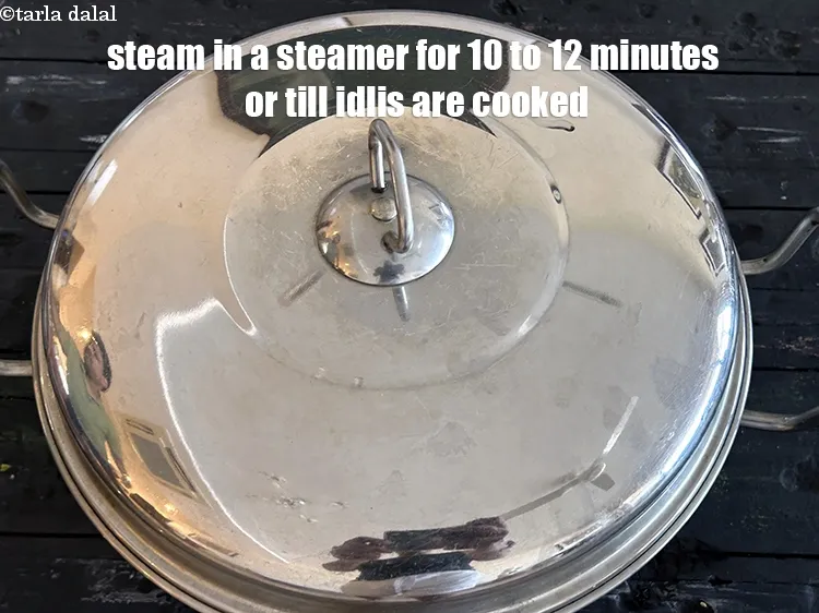 Step 36 – <meta charset="UTF-8" />Steam in a steamer for 10 to 12 minutes or till the idlis …