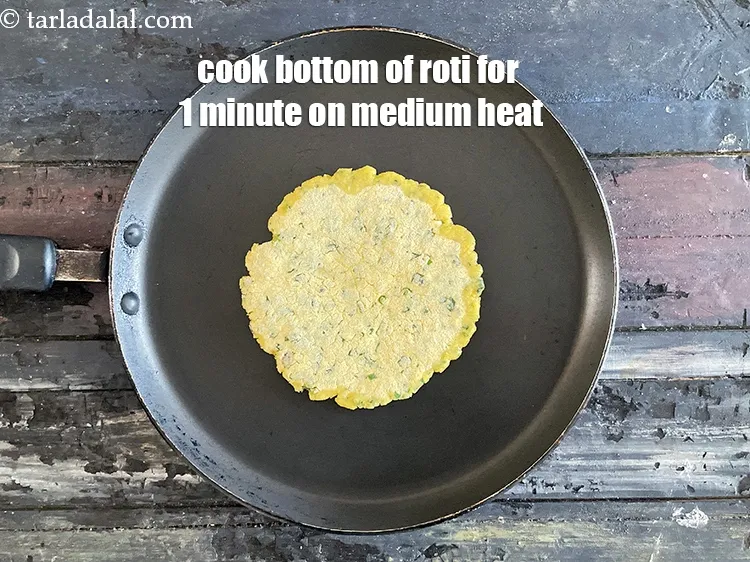 Step 19 – Cook the bottom of the roti for 1 minute on a medium flame.