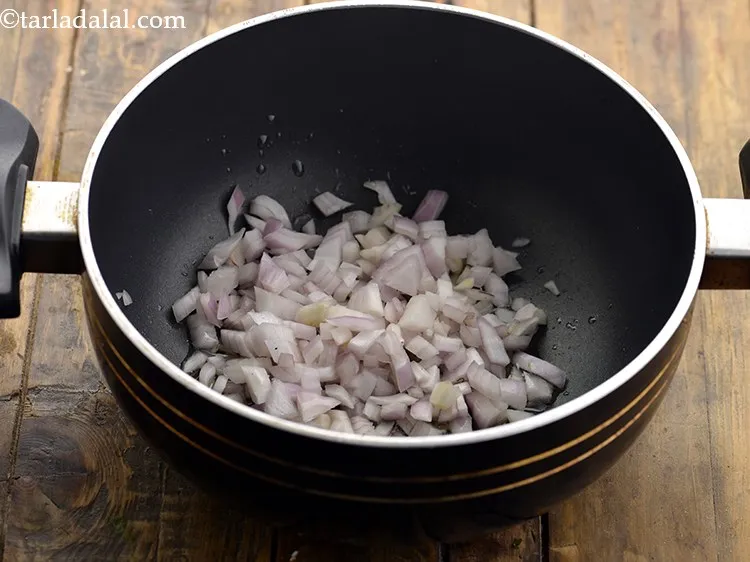 Step 11 – Once the oil is hot, add the onions.