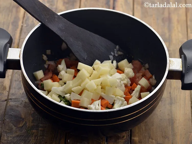 Step 18 – Also, add the potato cubes.You can use any vegetables of your choice and liking depending …