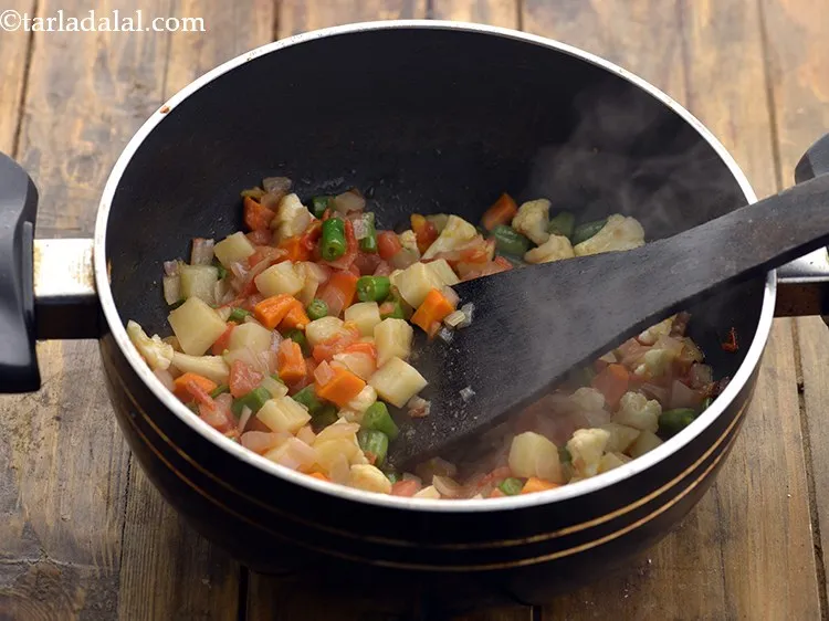 Step 19 – Mix well and saut&eacute; on a medium flame for 2 minutes.