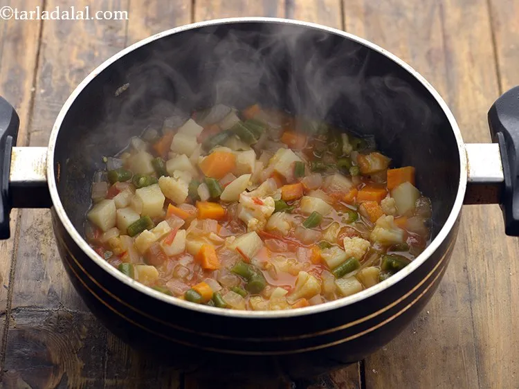 Step 21 – Mix well and cover with a lid and cook on a medium flame for 10 …