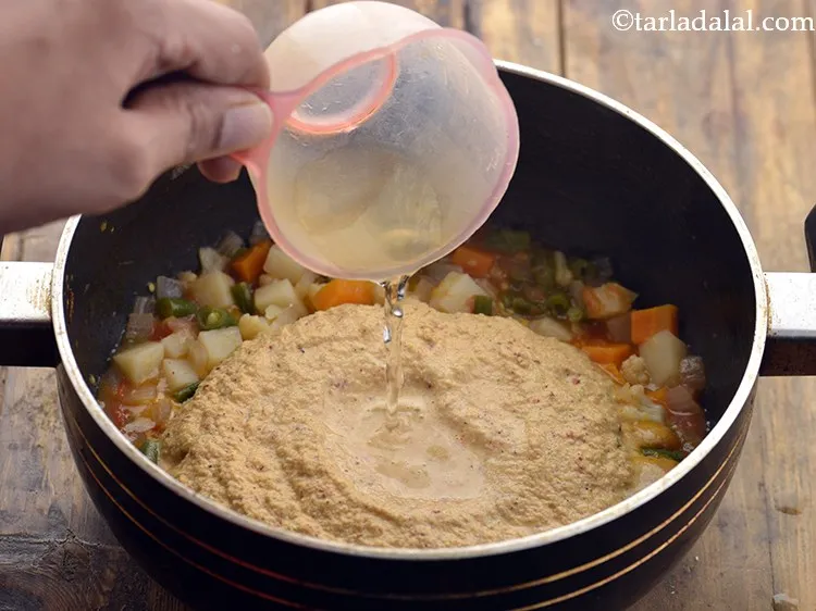 Step 23 – Add &frac14; cup of water. Adjust the consistency of the curry as per your desire.