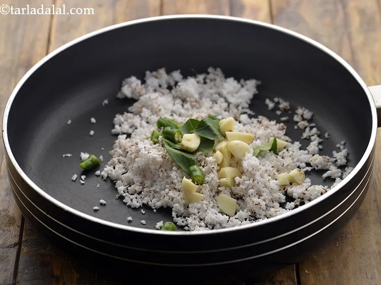 Step 4 – Add roughly chopped green chillies and garlic.