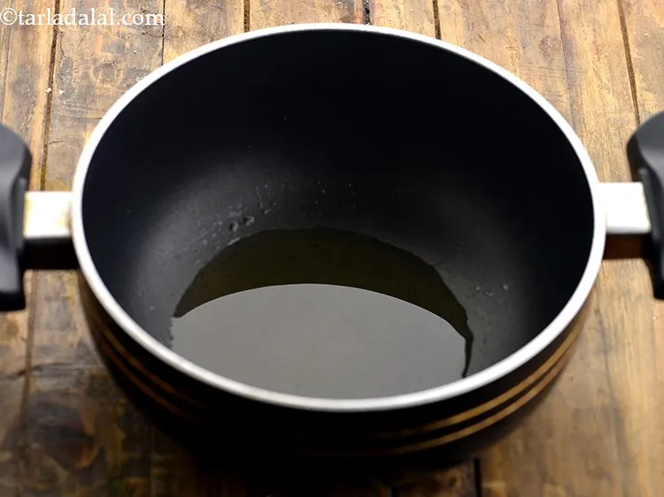 Step 10 – To prepare the <strong>Malabari vegetable curry</strong>, heat the oil in a deep non-stick kadhai. We …