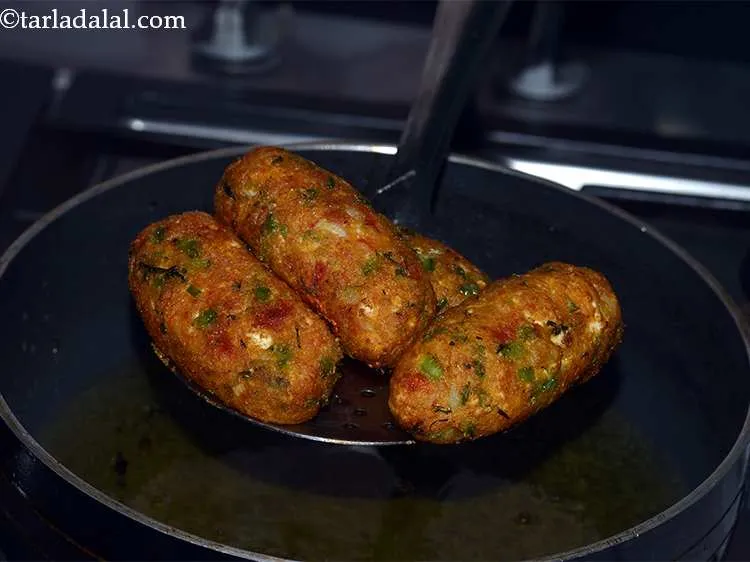Step 41 – Deep-fry the koftas on a medium flame till they turn golden brown in colour from …