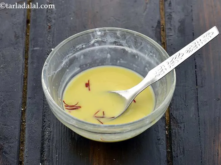Step 5 – Put the saffron into it. Mix well and keep aside.