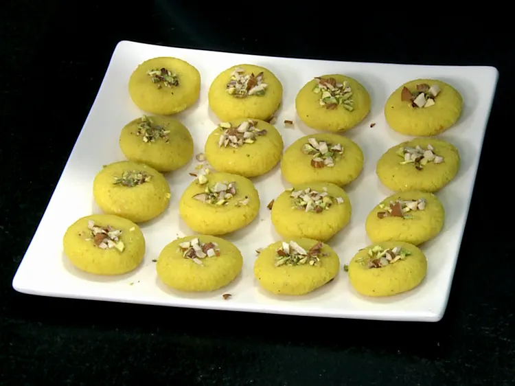 Step 18 – Garnish each peda with pistachio and almond and press it gently. You can use any …