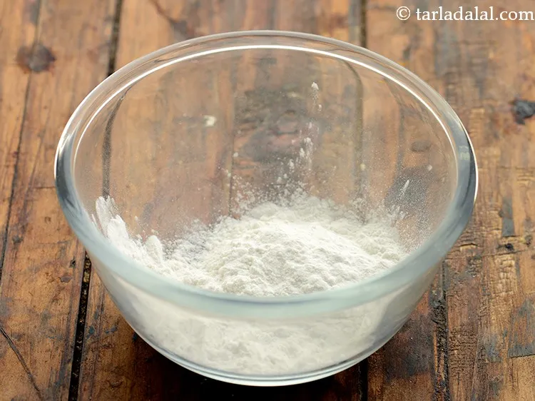 Step 12 – To thicken the <strong>Manchow soup</strong>, we would require a cornflour slurry. In a small bowl …