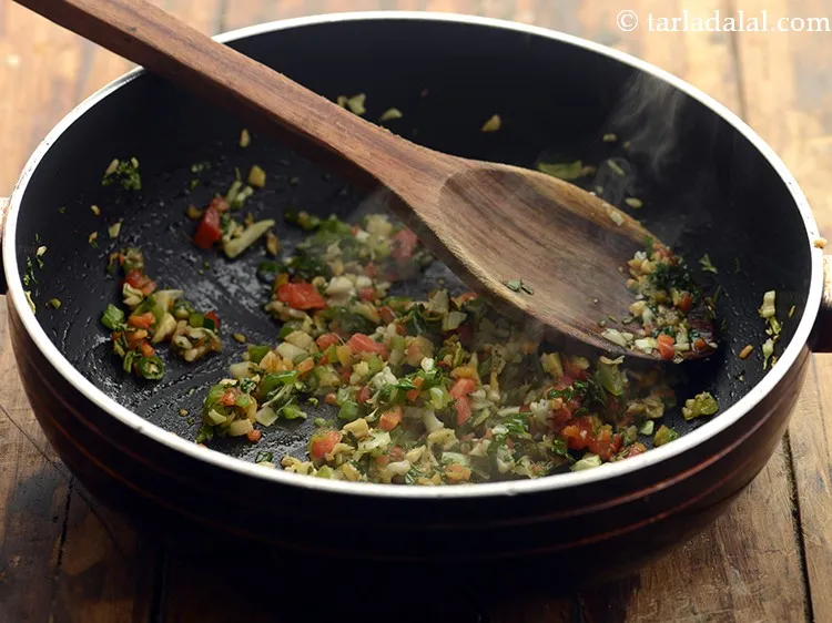 Step 28 – Mix well and saut&eacute; on high flame for 1 minute.
