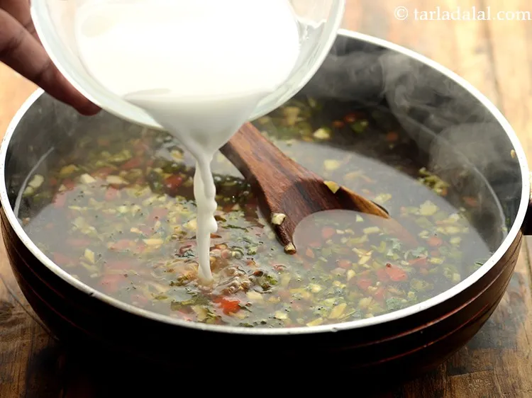 Step 34 – Stir and add the prepared corn flour-water mixture. The soup must be bubbling hot when …