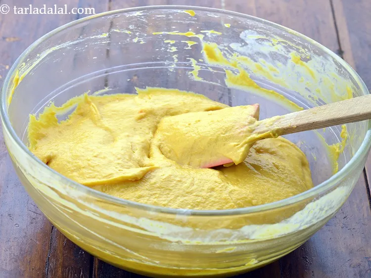 Step 23 – Fold in gently using a spatula. The batter for the <strong>mango cake recipe | eggless …