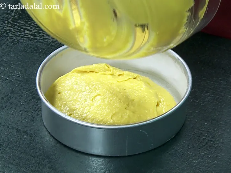 Step 26 – Pour the batter into this greased and dusted cake tin.