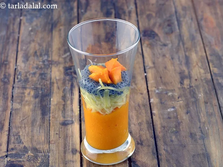 Step 14 – Add 1 tbsp of <a href="https://www.tarladalal.com/glossary-chopped-mango-803i">chopped mangoes</a> for all the more mango flavour in <strong>mango …