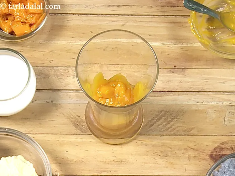 Step 11 – Just before serving, put &frac14; cup of the prepared mango pulp in a tall glass.