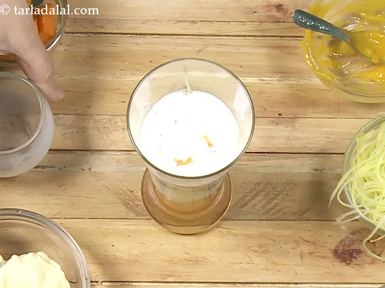 Step 15 – Pour &frac14; cup of chilled&nbsp;<a href="https://www.tarladalal.com/glossary-milk-514i">milk</a>. Use chilled milk as this dessert has to be …