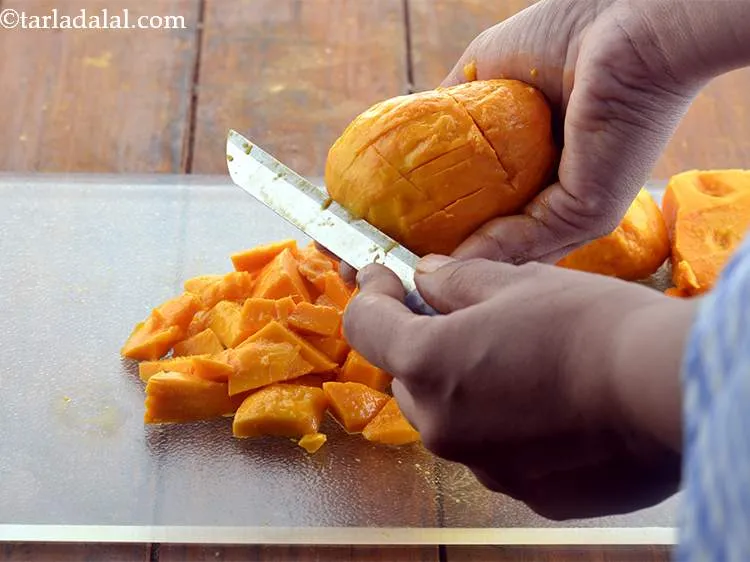 Step 3 – Chop the mangoes up roughly. Do not discard the seed.