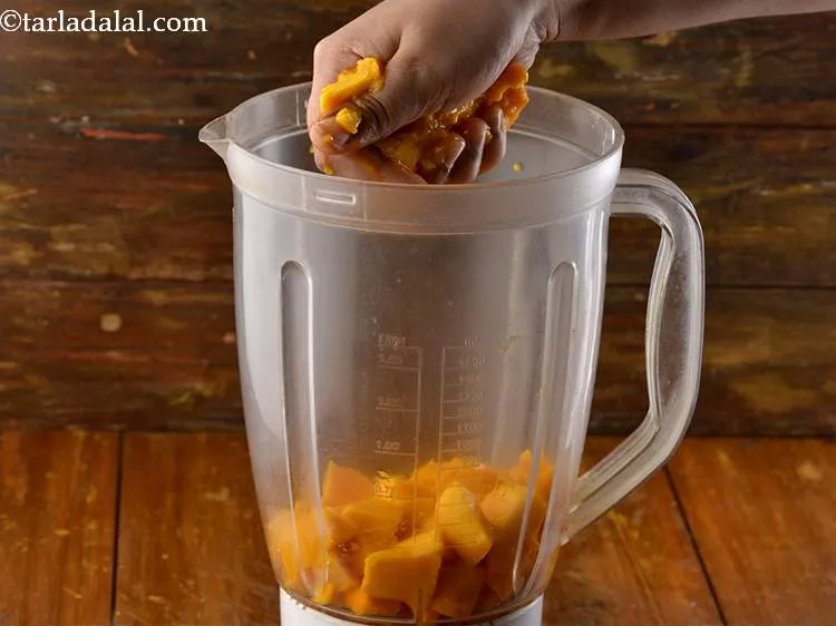 Step 5 – Squeeze the seeds over the mixer jar with your hands to extract all the pulp …