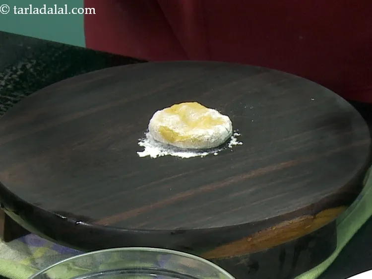 Step 21 – Place a portion on the rolling board. Sprinkle little plain flour for rolling.