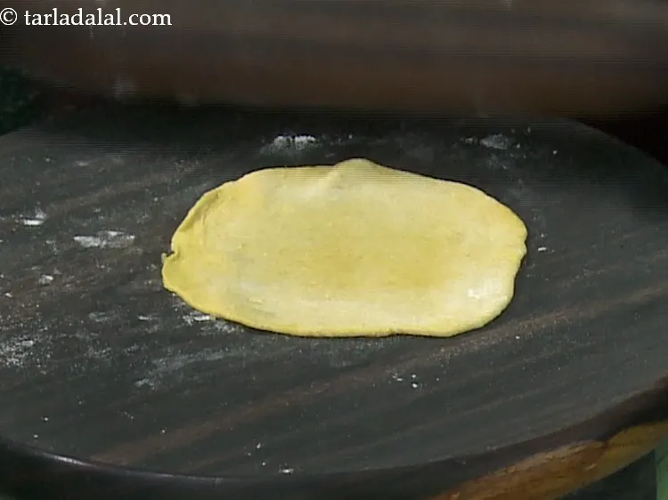 Step 22 – Roll out into a 100 mm. (4&rdquo;) diameter circle. Repeat to roll all the pooris.