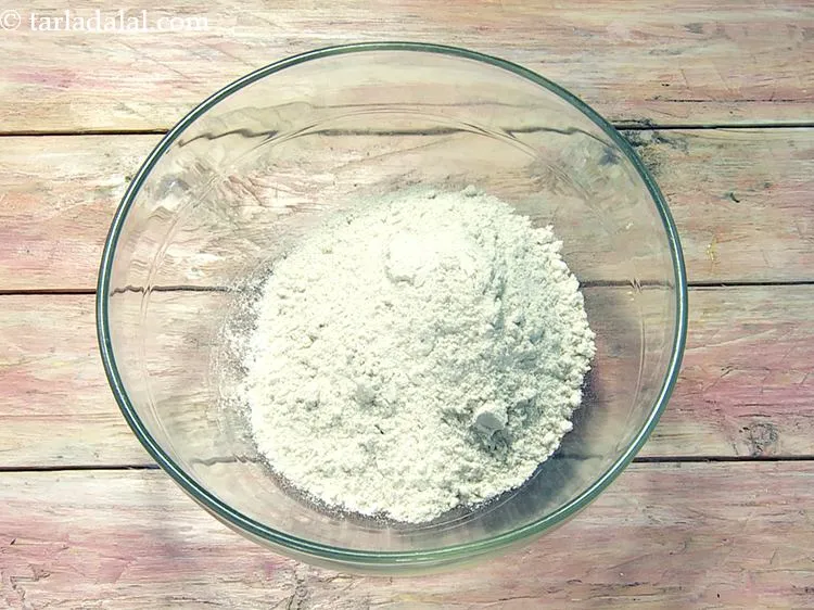 Step 14 – Add&nbsp;1/2 cup&nbsp;<a href="https://www.tarladalal.com/glossary-whole-wheat-flour-gehun-ka-atta-gehun-ka-aata-429i">whole wheat flour (gehun ka atta)</a>.